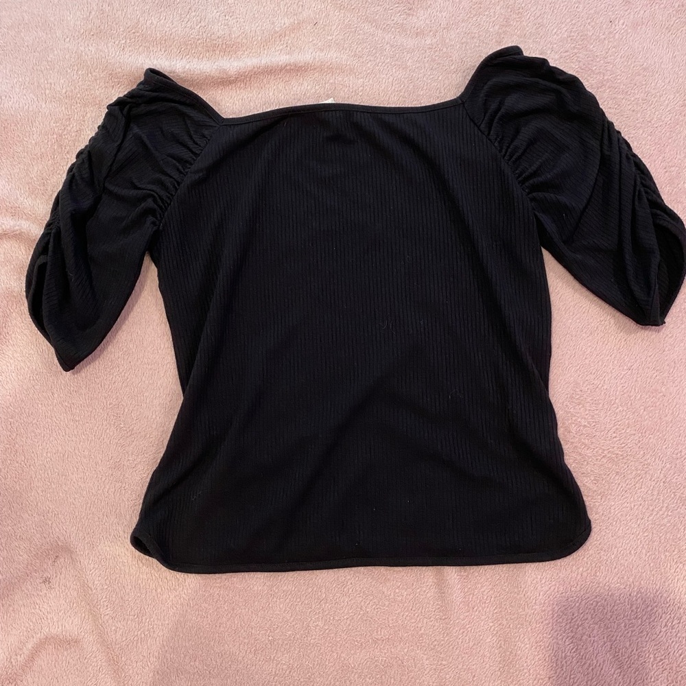 Black dressy in time truly top. Never worn without tag.